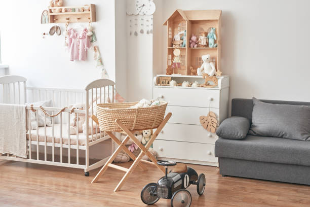 Modern nursery featuring 2025's innovative baby gear trends like a comfortable crib, soft baby blanket, and modular stroller.