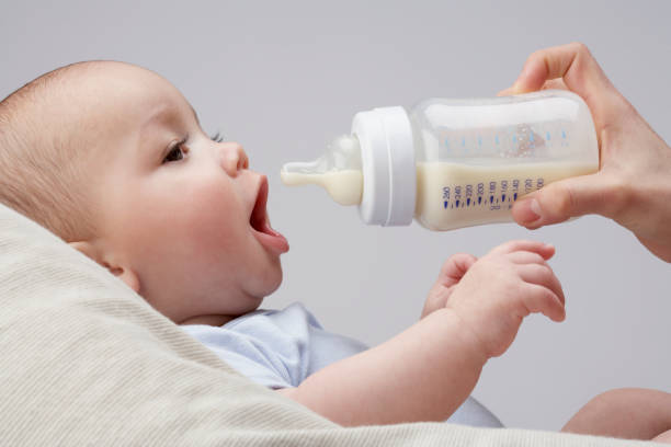 A baby being fed a bottle