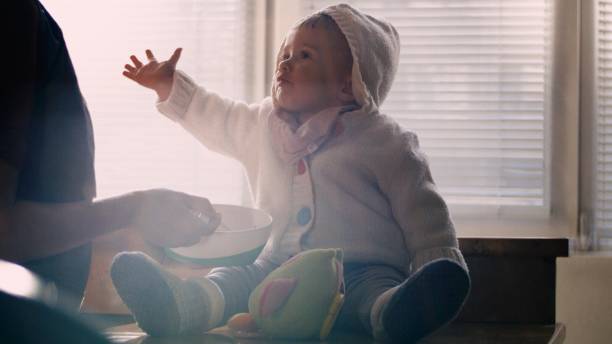 Baby wearing soft knitted cardigan suitable for all seasons.