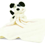 Plush toy dog with a white blanket on a white background