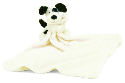 Plush toy dog with a white blanket on a white background