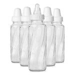 Set of five clear baby bottles with white caps on a white background