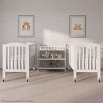 Dream On Me 2-in-1 Folding Portable Compact Mini Baby Crib in White, GreenGuard Gold & BSA, US Patented Flat Folding System, Locking Wheels,1″ Mattress Pad, Space-Saving Quck Fold Easy Storage