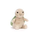 Plush turtle toy with a green shell on a white background