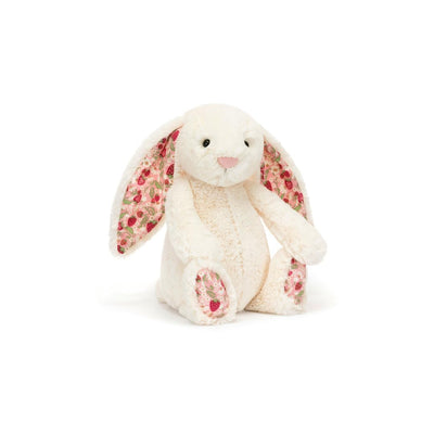 Floral-patterned plush bunny toy on a white background