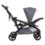 Baby Trend Sit N' Stand Tandem Double Stroller 2.0 DLX with 5 Point Safety Harness, Shaded Canopy, 2 Cup Holders, and Ample Storage Space, Magnolia