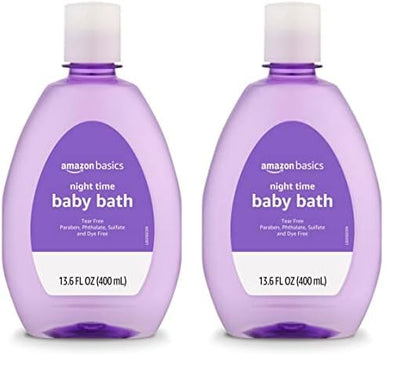 Two bottles of Amazon Basics night time baby bath on a white background