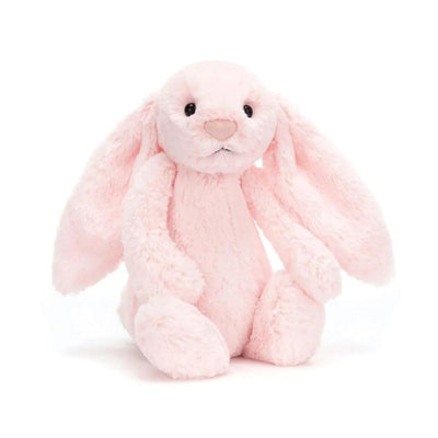 Pink plush bunny toy on a white background