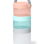 Stackable container with pink, blue, and white sections on a white background