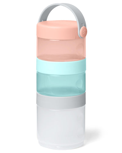 Stackable container with pink, blue, and white sections on a white background