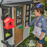 KidKraft Riverscape Wooden Playhouse with Working Doorbell, Fence, Kitchen and Pet Door