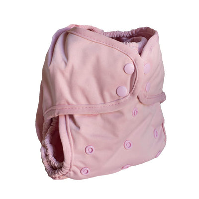 Pink baby diaper with button closures on a white background