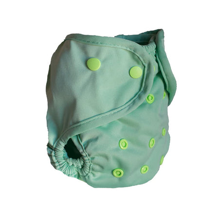 Green cloth diaper with button closures on a white background