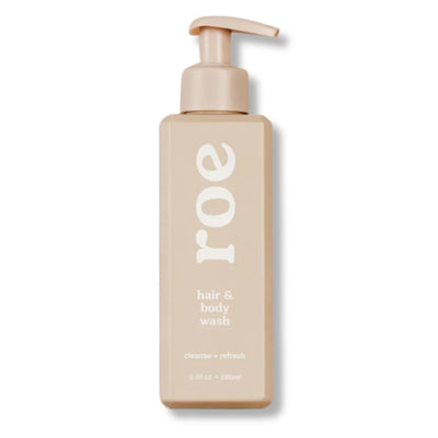 Beige bottle of hair and body wash with pump on a white background