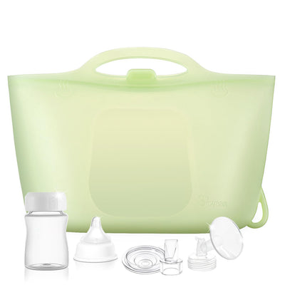 Green silicone bag with breast pump parts on a white background