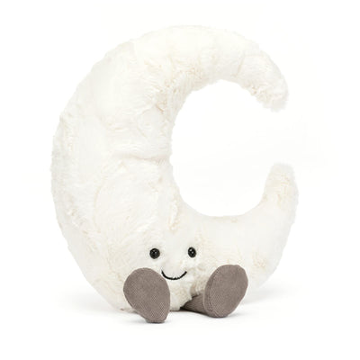 Plush toy shaped like a crescent moon with a smiling face on a white background