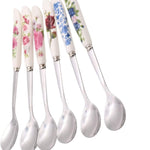 Set of six floral-patterned spoons on a white background