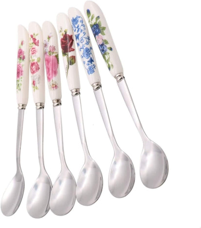 Set of six floral-patterned spoons on a white background