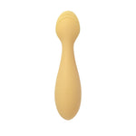Beige silicone baby spoon on a white background