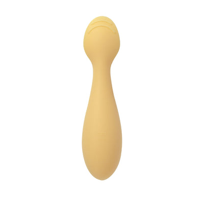 Beige silicone baby spoon on a white background