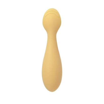 Beige silicone baby spoon on a white background