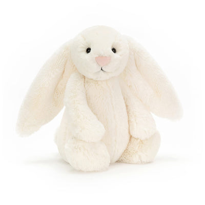 White plush bunny toy on a white background