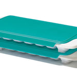 Turquoise and white ice cube tray on a white background