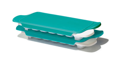 Turquoise and white ice cube tray on a white background