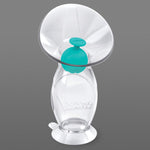 Nuby breast pump on a gray background