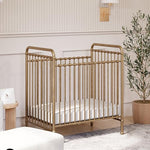 Namesake Abigail 3-in-1 Portable Baby Crib with Wheels - GREENGUARD Gold Certified Convertible Crib to Toddler Bed & Daybed - Metal Baby Bed w/ 4 Adjustable Mattress Heights, for Small Spaces - Gold