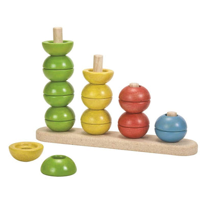 Colorful wooden stacking toy with multiple levels on a white background