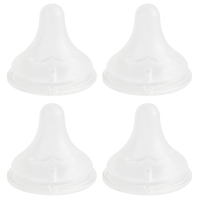 Four white silicone bottle nipples on a white background