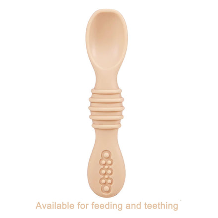 Beige baby spoon with textured handle on a white background