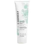 Tube of Honest Company sensitive face and body lotion on a white background