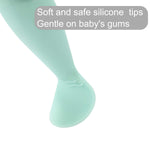 Mint green baby tights with text about soft silicone tips on a white background