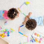 LOVEVERY | The Block Set | Solid Wood Building Blocks and Shapes + Wooden Storage Box, 70 Pieces, 18 Colors, 20+ Activities, Toddler Block Set and Converts into a Pull Car, Ages 12 to 48+ months