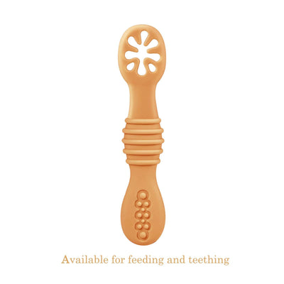 Orange baby teether on a white background