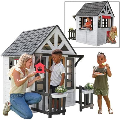 KidKraft Riverscape Wooden Playhouse with Working Doorbell, Fence, Kitchen and Pet Door