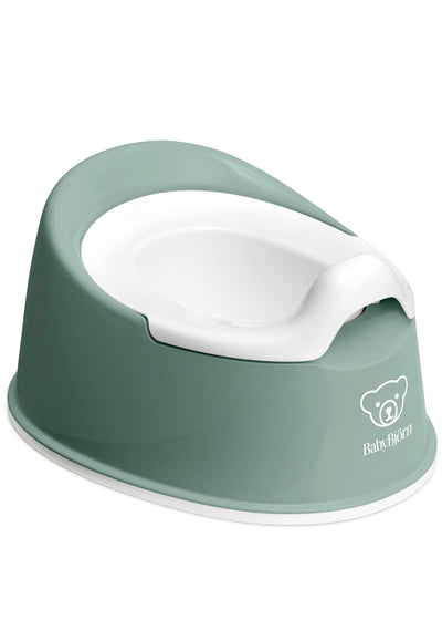 Green and white baby potty with 'BabyBjörn' branding on a white background