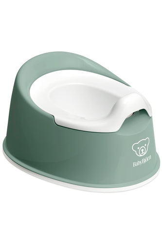 Green and white baby potty with 'BabyBjörn' branding on a white background