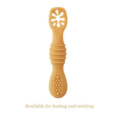 Yellow baby teething toy on a white background