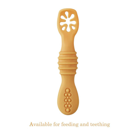 Yellow baby teething toy on a white background