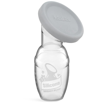 Handheld silicone breast pump with a gray cover on a white background