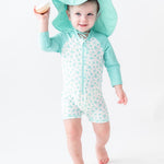 RUGGEDBUTTS Long Sleeve One Piece Rash Guard - Whimsical Charm - 6-12m White/Blue