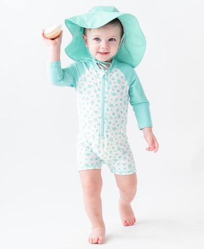 RUGGEDBUTTS Long Sleeve One Piece Rash Guard - Whimsical Charm - 6-12m White/Blue