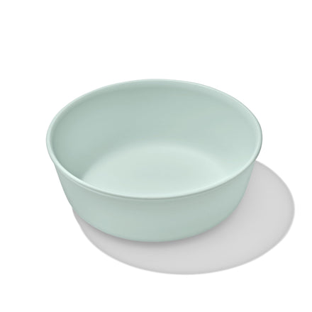 Light green ceramic bowl on a white background