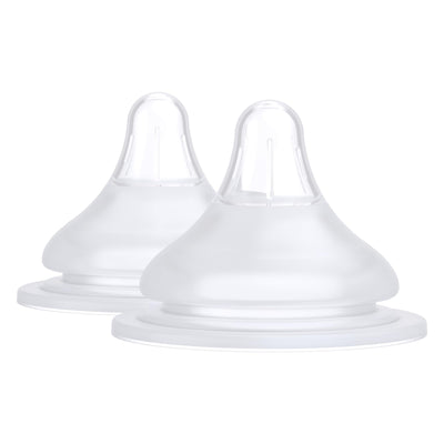 Two clear baby bottle nipples on a white background