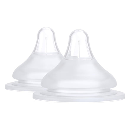 Two clear baby bottle nipples on a white background