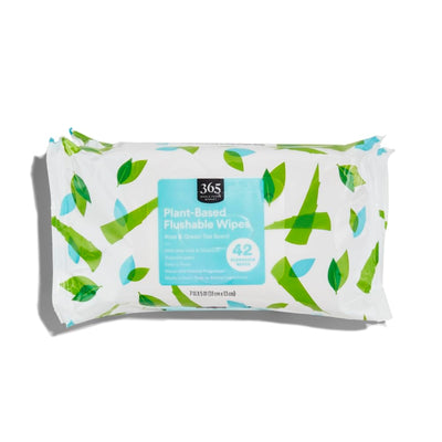 Pack of plant-based flushable wipes with leaf design on a white background