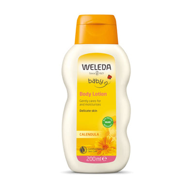 Weleda baby body lotion bottle with yellow and white design on a white background
